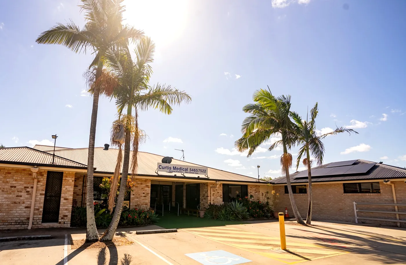 Curtis Medical clinic exterior with palm trees